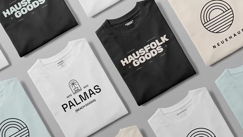 Assorted color t-shirts with heat transfer logos and images